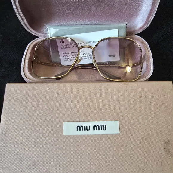 Miu Miu Gold and Pink Glasses with Chic Design